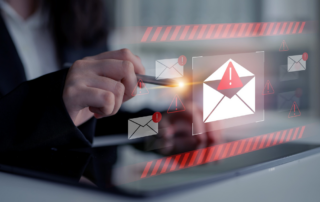 Employee identifying a phishing email — one of the most common ways cybercriminals enter business systems