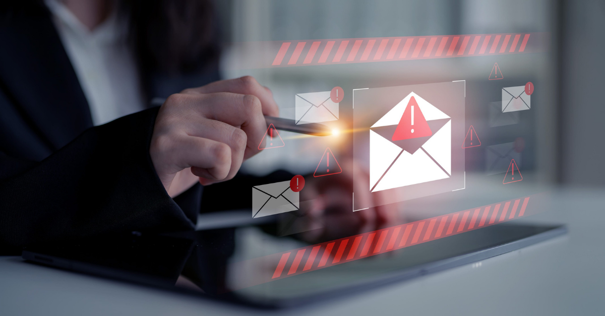 Employee identifying a phishing email — one of the most common ways cybercriminals enter business systems