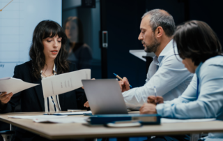 Business professionals discussing managed IT services and technology strategy.