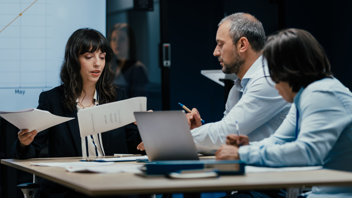 Business professionals discussing managed IT services and technology strategy.