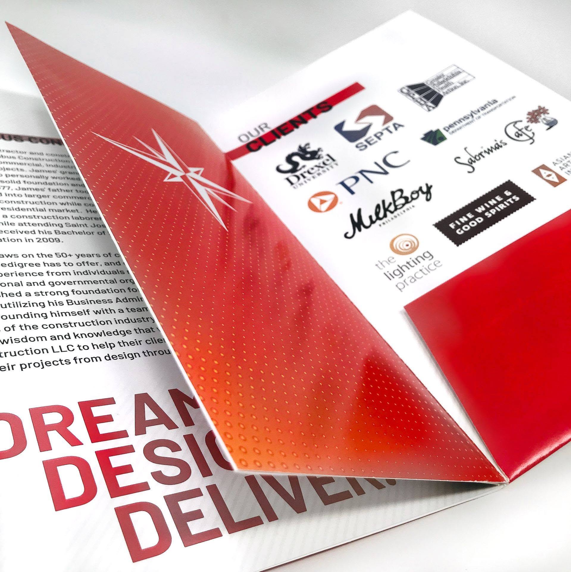 Custom printed Columbus Construction corporate booklet featuring company information, client logos, and red branded design.