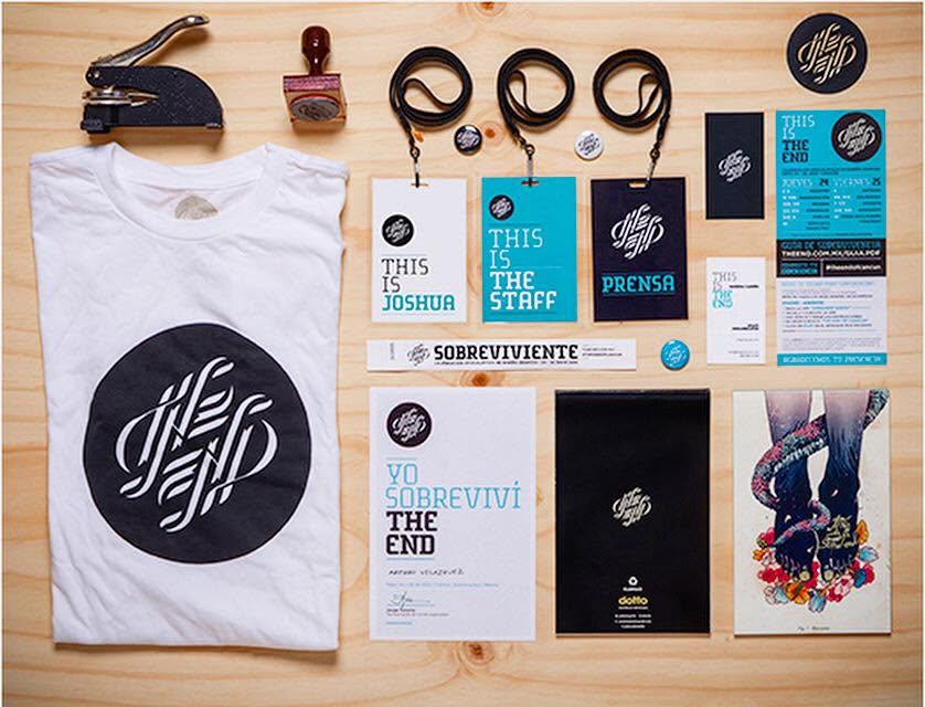 Custom branded event materials featuring printed invitations, promotional cards, event passes, and coordinated black, white, and turquoise designs.