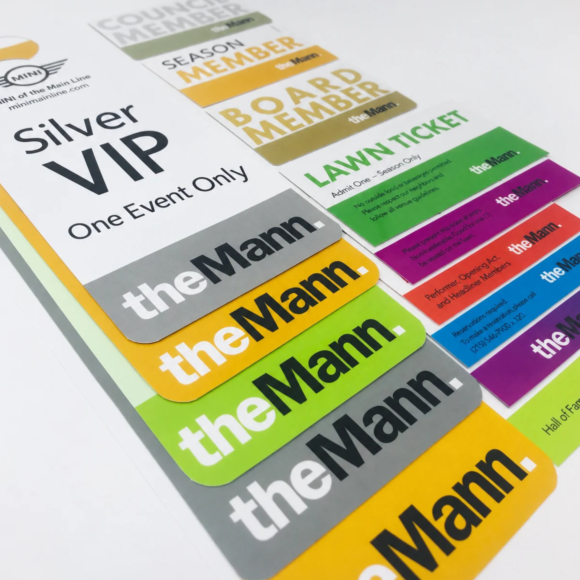 Custom Event Tickets & Membership Materials | Media Copy Custom printed event tickets, VIP passes, and membership materials for The Mann, featuring coordinated colors and branding.